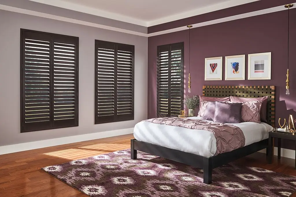 graber wood shutters in a bedroom