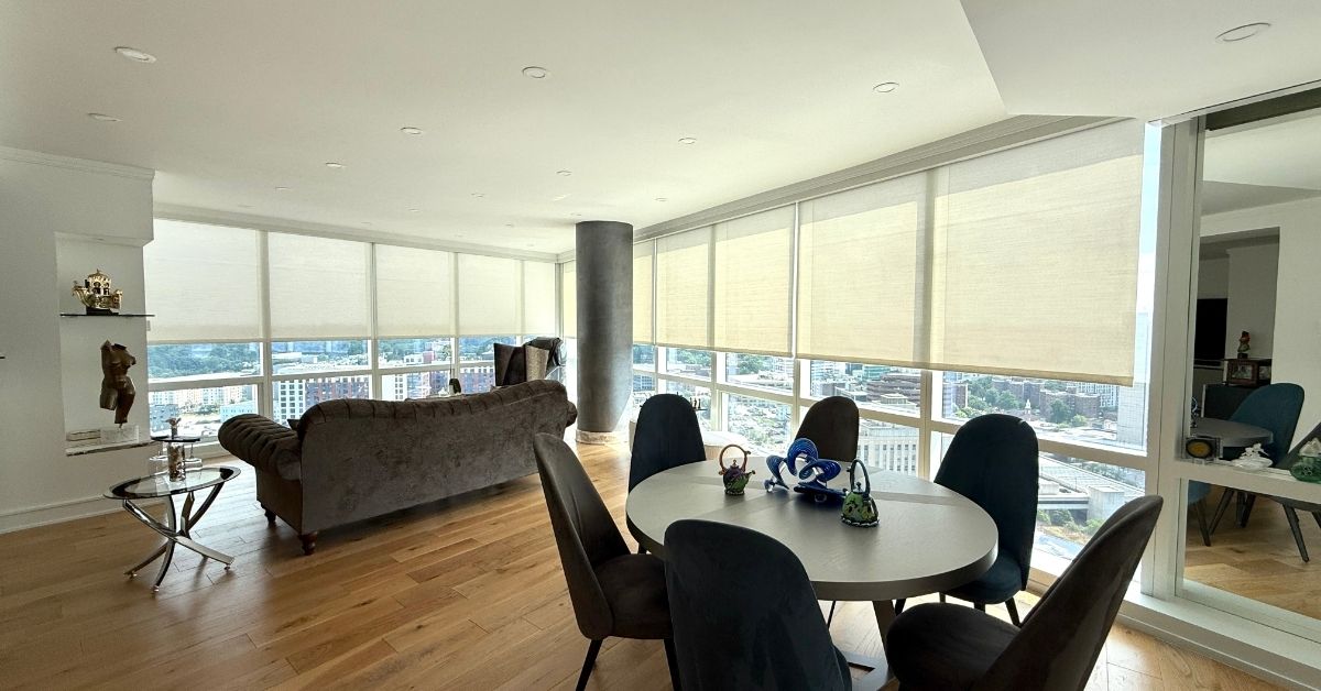White Motorized Solar Shades in High Rise Apartment